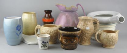 A collection of assorted ceramic jugs and chamber pots to include Arthur Wood.