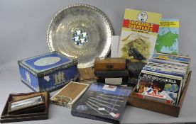 A mixed collection of assorted items to include; tins, booklets, tea cards and a chased metal tray.