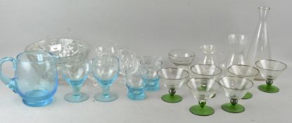 A collection of assorted glassware mostly clear glass with some aqua glass. Tallest measures; 26cm.