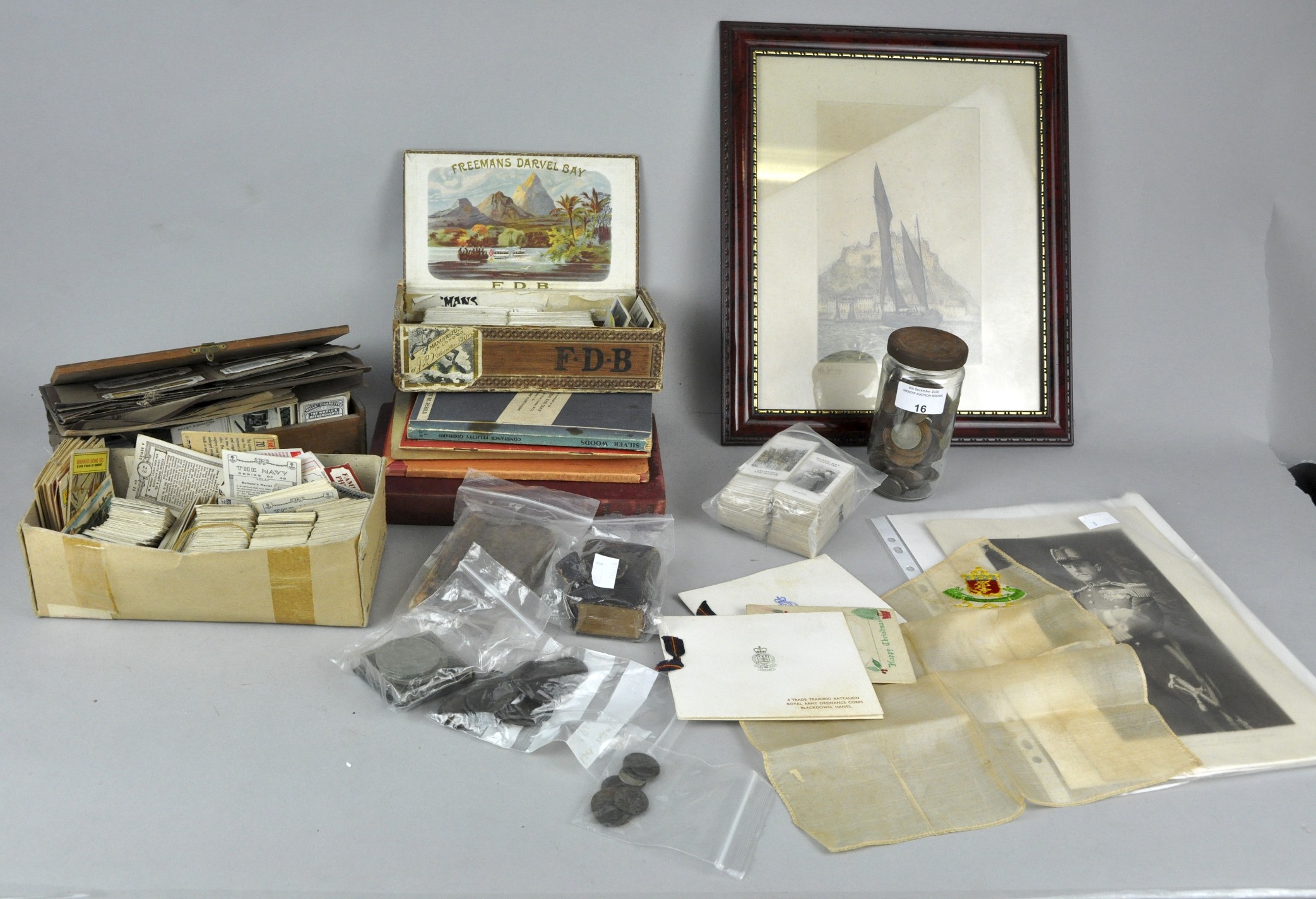 A group of assorted coins and cigarette cards