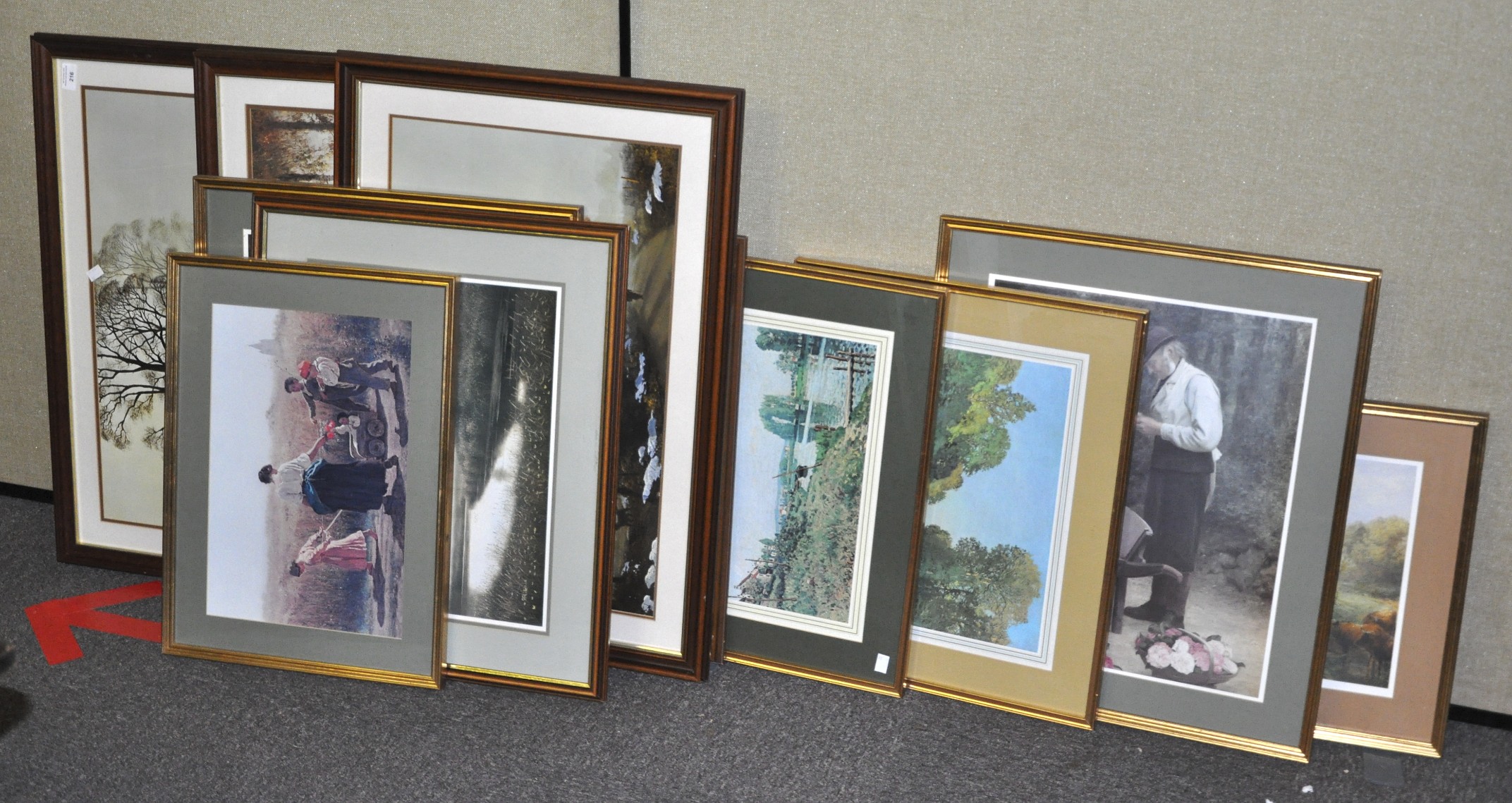 A collection of framed and glazed landscape prints depicting country scenes.