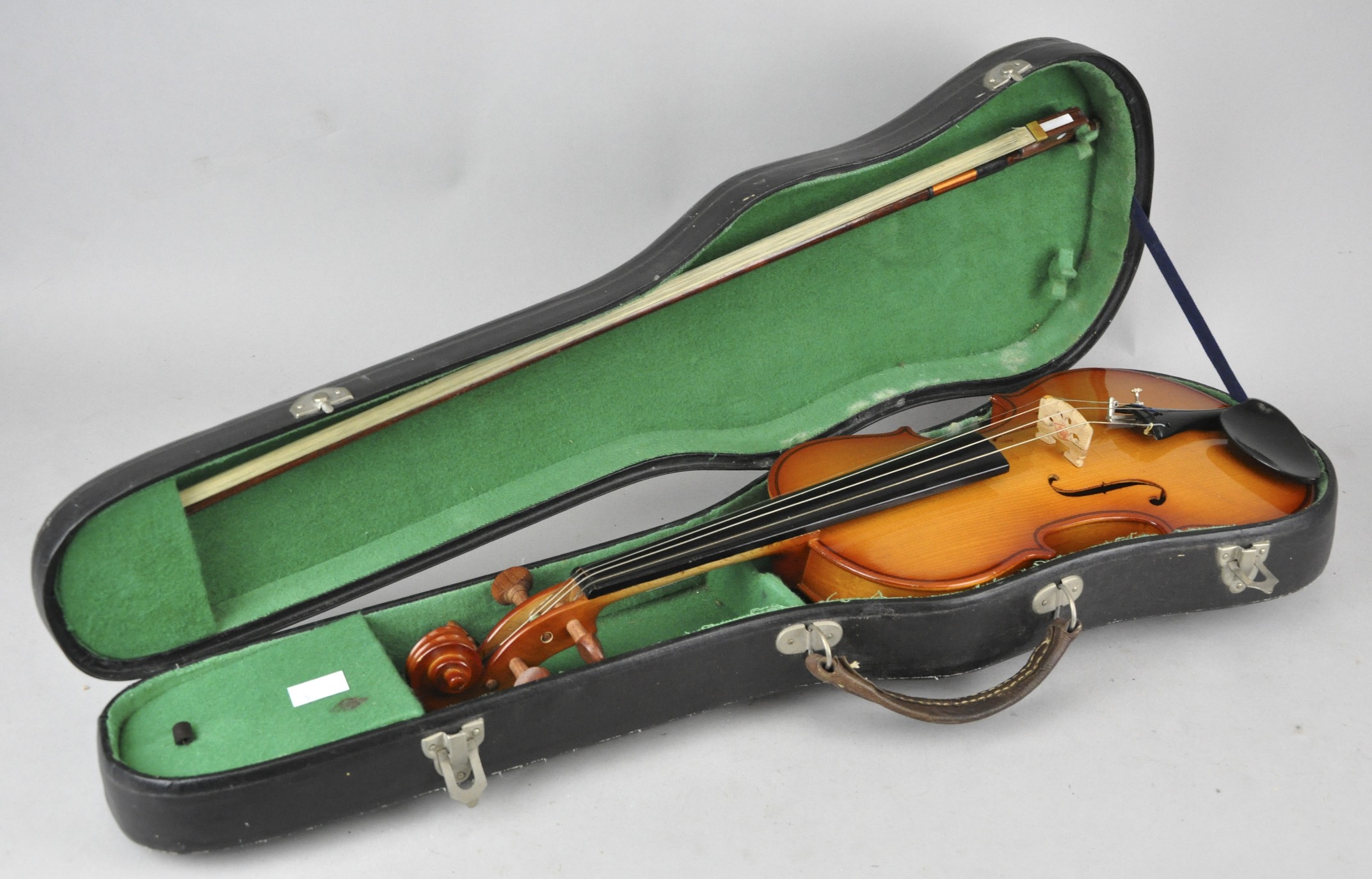 A Chinese Parrot brand child's size violin, with paper label to the inside, and bow,
