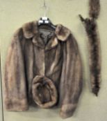 A mink coat and a hat and two pelts