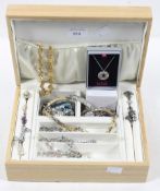 A jewellery box containing a selection of costume jewellery,
