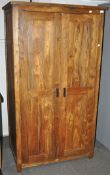 A hard wood two door double wardrobe,