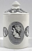 A 'Fornasetti' lidded candle, decorated with Roman portraits, A/F,