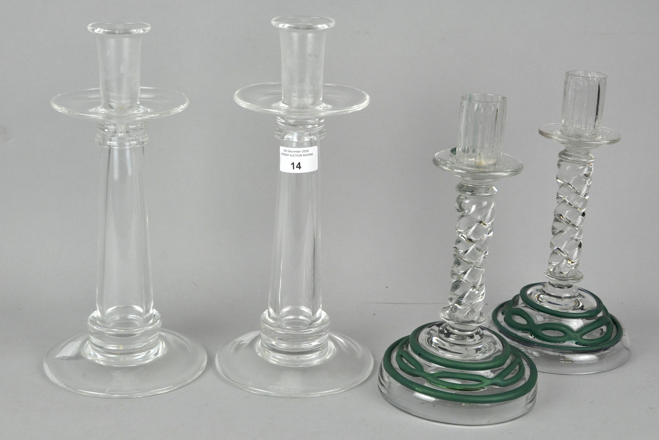 Two pairs of glass candlesticks,