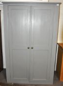 A grey painted oak two panel door double wardrobe,