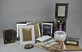 A collection of postcards, picture frames and curios.