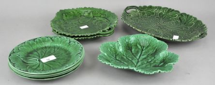 A collection of Wedgwood and Majolica green leaf plates. Largest measures; 31cm wide.