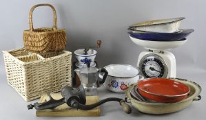 A group of enamel kitchen ware and a coffee grinder