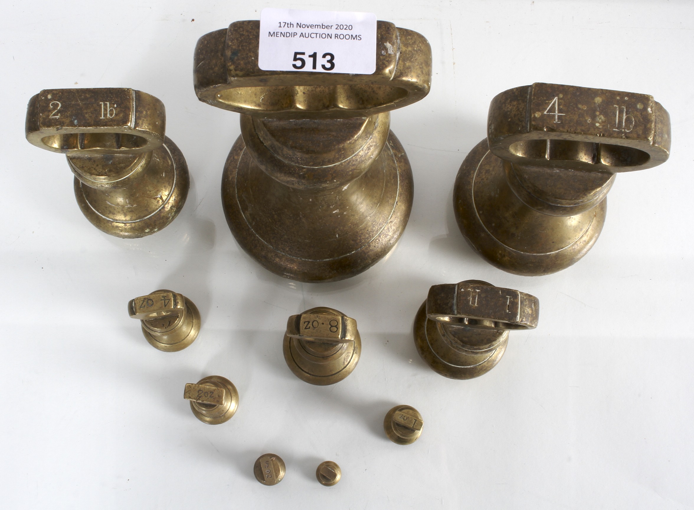 A set of nine vintage graduating brass bell weights ranging from 7lbs to 1/4oz, largest marked EIIR. - Image 2 of 2