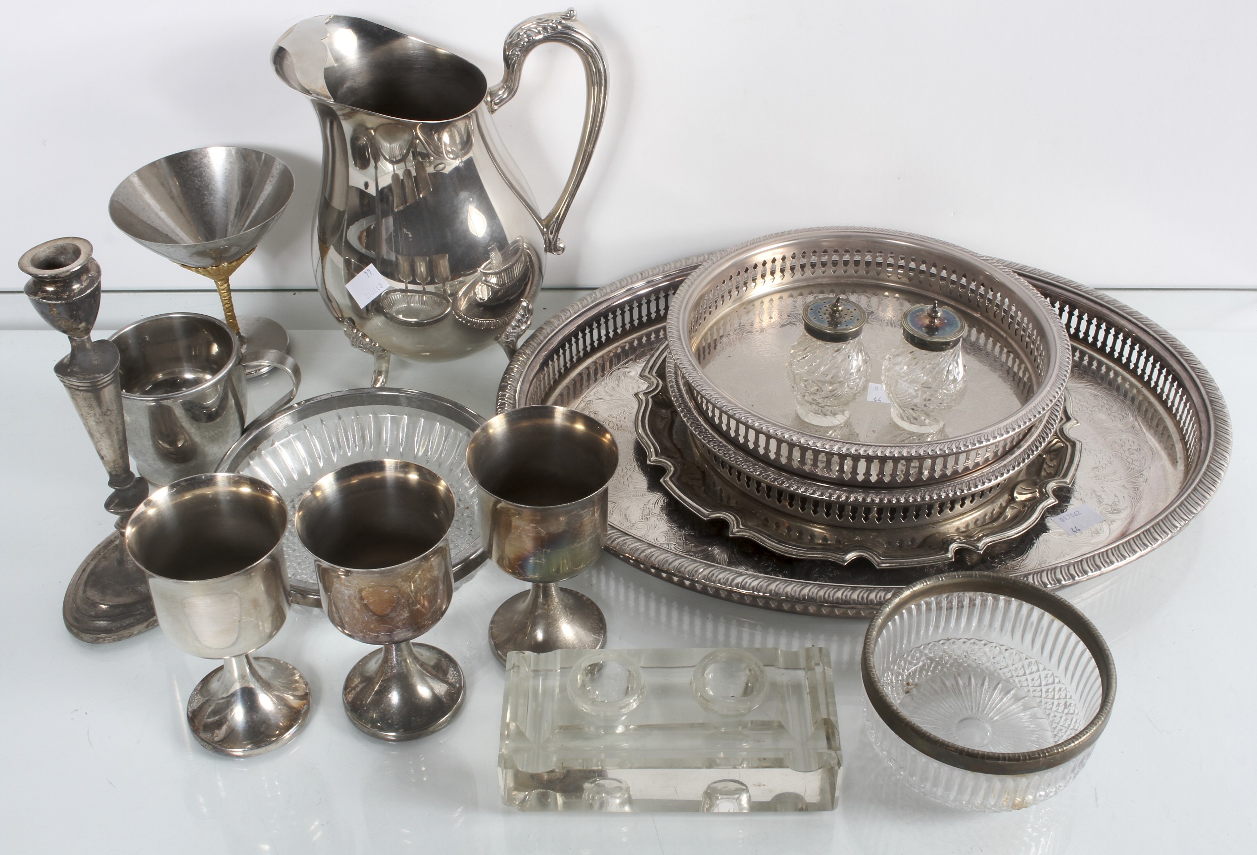A collection of silver plate items to include two salvers and a water jug. Tallest measures; 22cm.