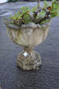 A composite stone garden urn in the shape of a flower H 58cm W 49cm