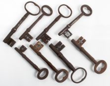 A group of eight antique large cast iron keys