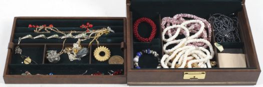 A jewellery box containing costume jewellery,
