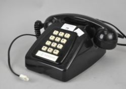 A black push button telephone, Model no 782R,