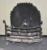 A period cast iron fire basket with integral cast fire back. Measures; 58cm high x 52cm wide.