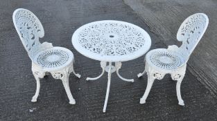 A white painted metal garden table, 64cm high x 68cm diameter,
