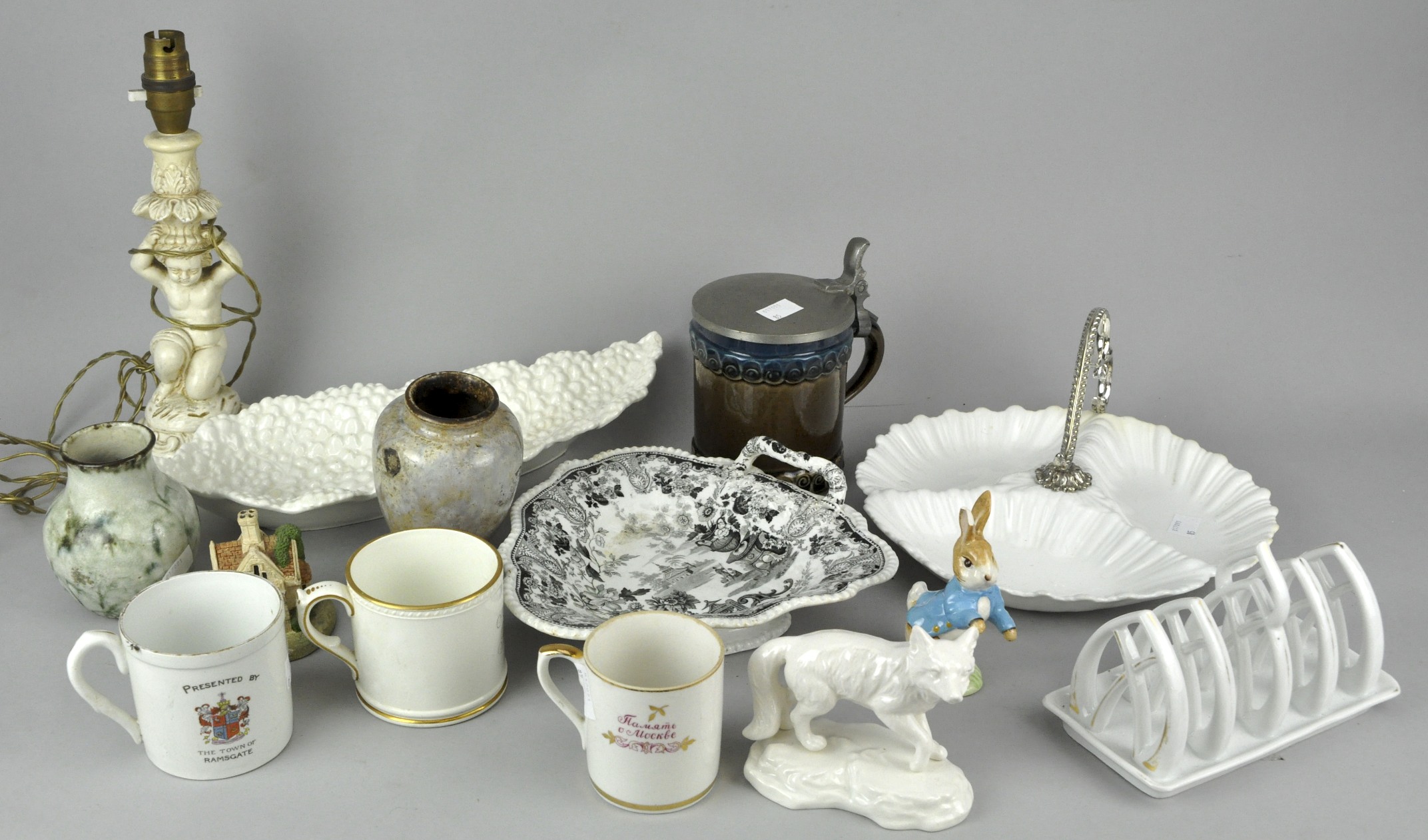 A Putti lamp, nut dish, fox, studio pottery vases and Commemorative mugs. Tallest measures; 29cm.