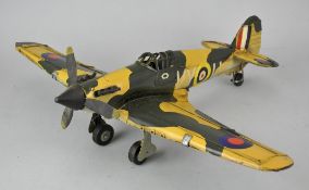 A painted metal model of a military plane,