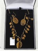 A matching Tigers eye necklace and earrings