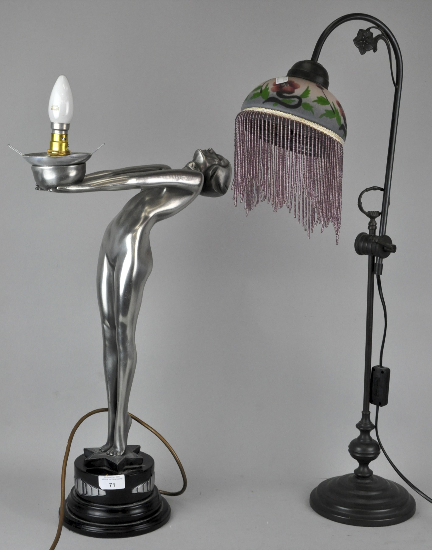 An Art Deco style figural lamp and an Art Nouveau style lamp with glass shade.