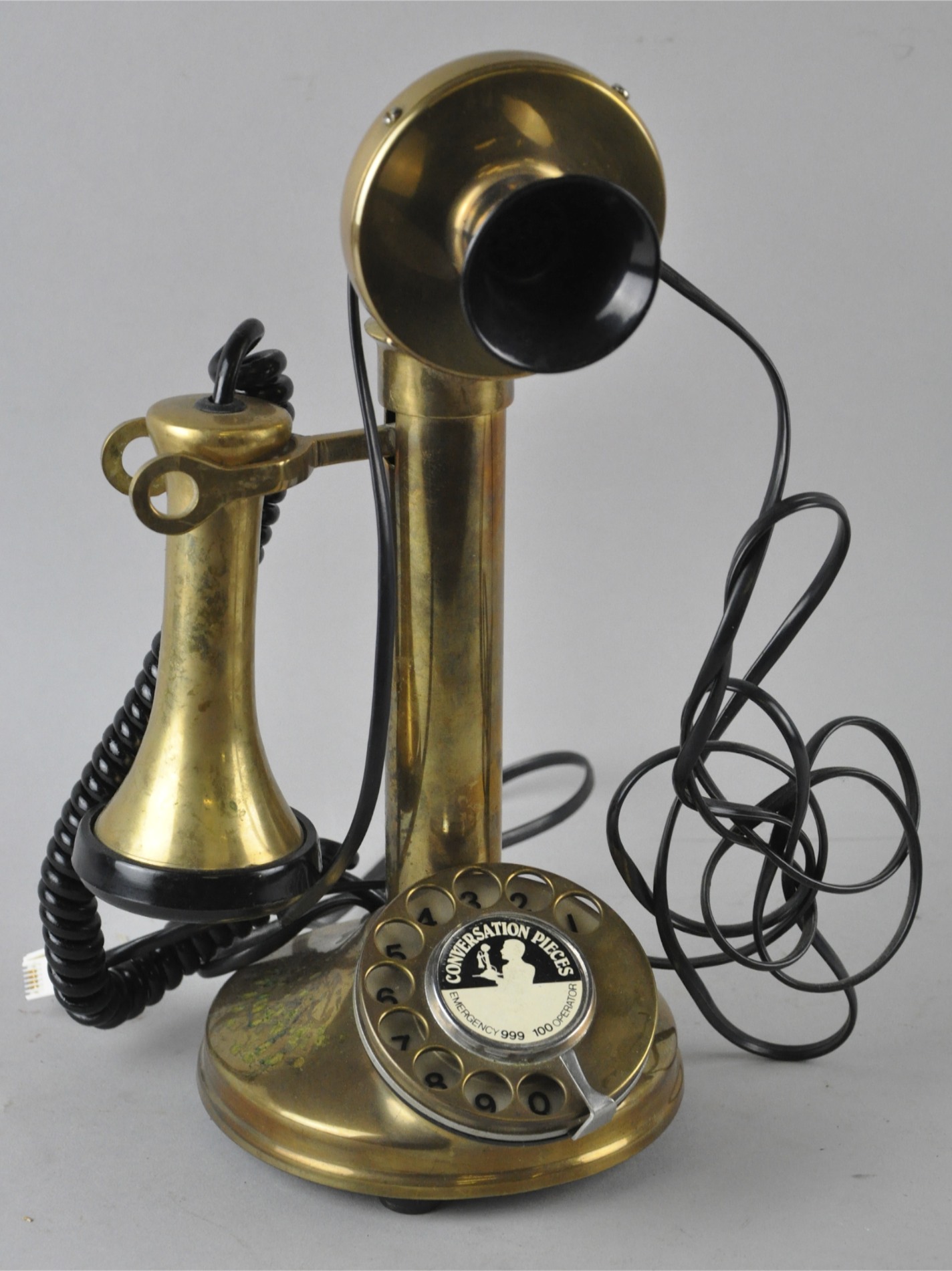 A brass vintage style candlestick telephone.