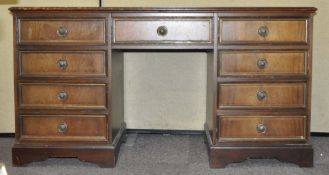 A reproduction twin pedestal kneehole desk . Measures; 72cm x 136cm x 46cm.
