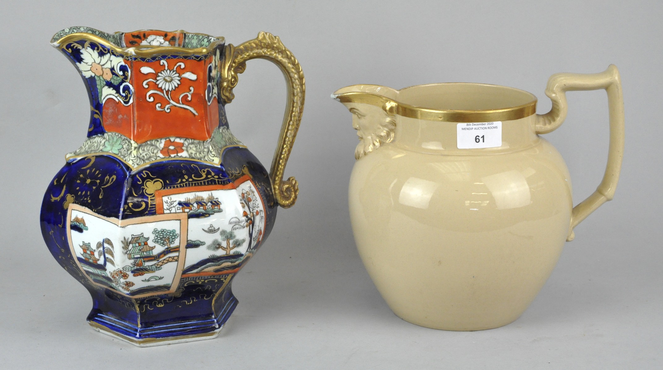 An Imari pattern Mason's jug along with a large bulbous jug with moulded head spout.