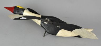 A vintage painted whirlygig in the form of a goose. Measures; 62cm.