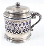 A silver mustard pot, of rounded pierced form,