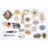 Twenty costume brooches