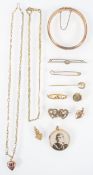 A collection of jewellery to include: Three 9ct gold brooches, A 9ct heart pendant with chain,