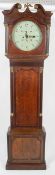 An early 19th century oak and mahogany long case clock case on a plain cut corner base with applied