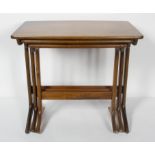 A Danish Aframosia, mid-century nest of three tables,