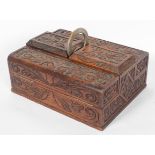 An oak workbox, late 19th century, with two hinged compartments flanking a pair of deep boxes,
