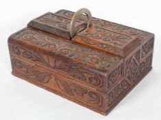 An oak workbox, late 19th century, with two hinged compartments flanking a pair of deep boxes,