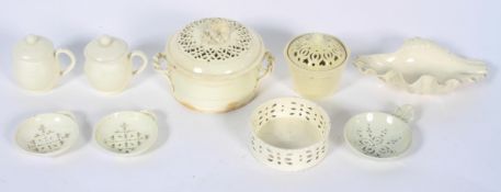 A pair of English creamware strainers, early 19th century, another similar,