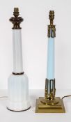 A gilt metal and milk glass lamp base, of faceted mallet form, 57cm high,