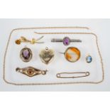 A collection of jewellery to include: Three pendants, Five brooches and a chain.