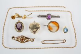 A collection of jewellery to include: Three pendants, Five brooches and a chain.