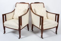 A pair of Edwardian mahogany and line inlaid bergere chairs, with upholstered back,