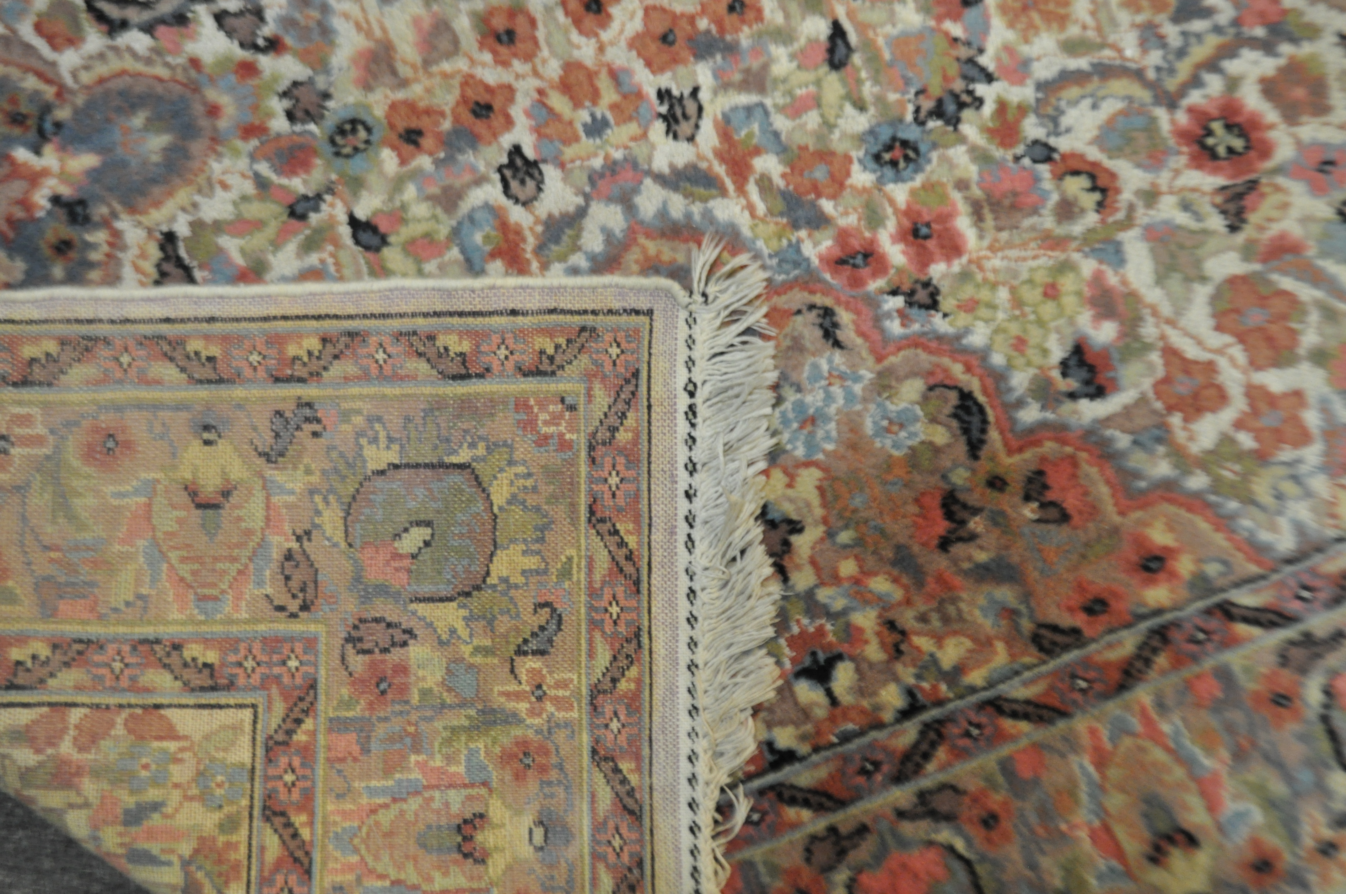 A Middle Eastern carpet the central cream ground with central medallion and floral decoration - Image 2 of 3