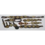 A late 19th century leather Martingale with seven horse brasses,