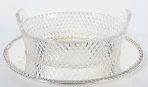 An 18th century Irish style glass butter dish,