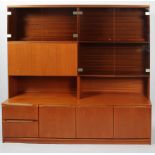 A teak 1970's modular shelving unit and sideboard, of rectangular section,