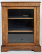 A Victorian oak inlaid bookcase, mid 19th century, of rectangular section,