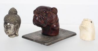 A cast model of a bulldog head on a silvered metal base, 6cm high and two parasol handles,