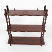 A late Victorian stained oak three tier hanging shelf,